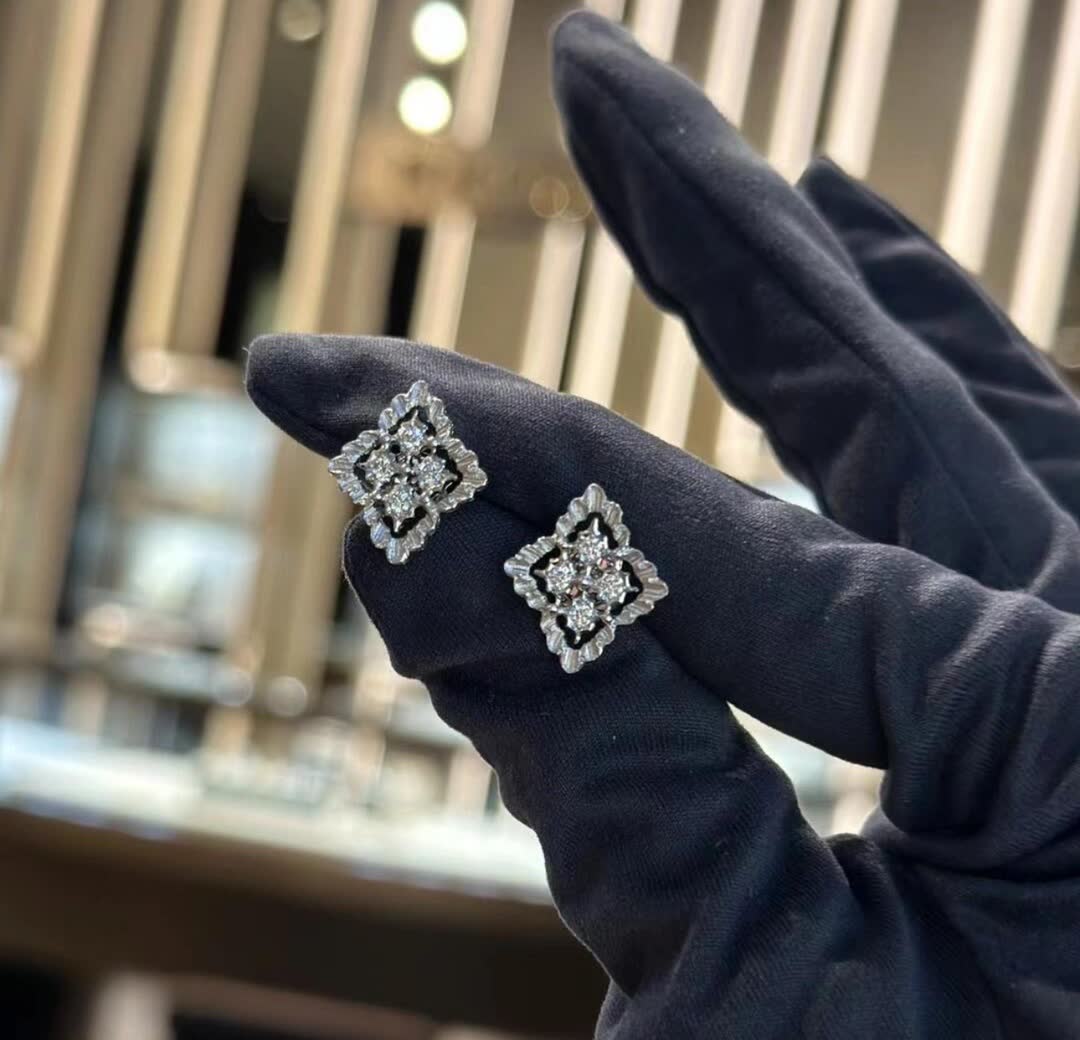 Van Cleef & Arpels Elegant Silver Stud Earrings with Diamond Accents